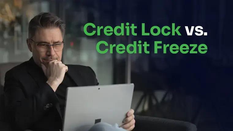 Blue, red and gold credit cards on the lock laying near keyboard