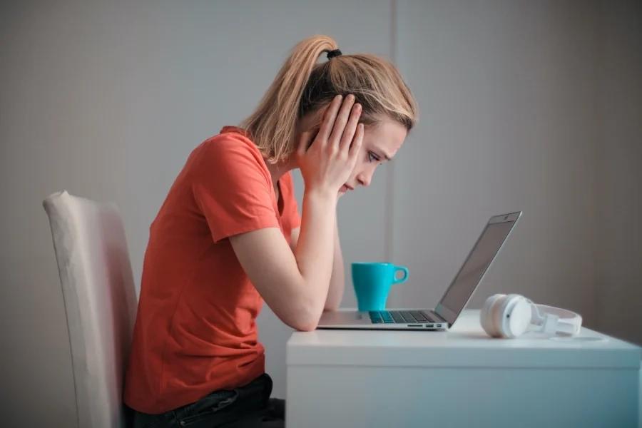 woman in despair thinking about credit card fraud