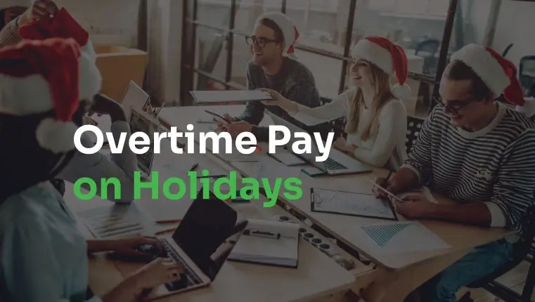 employees sitting in christmas hats behind work desks