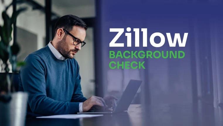 man in the office sitting in the laptop and checking his zillow background check