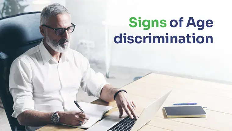 old man looking in his laptop signing documents