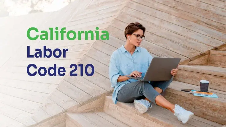 woman in a blue shirt sitting in her laptop