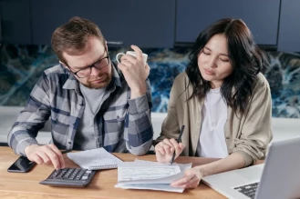 A couple trying to figure out why their FICO score lower than credit score