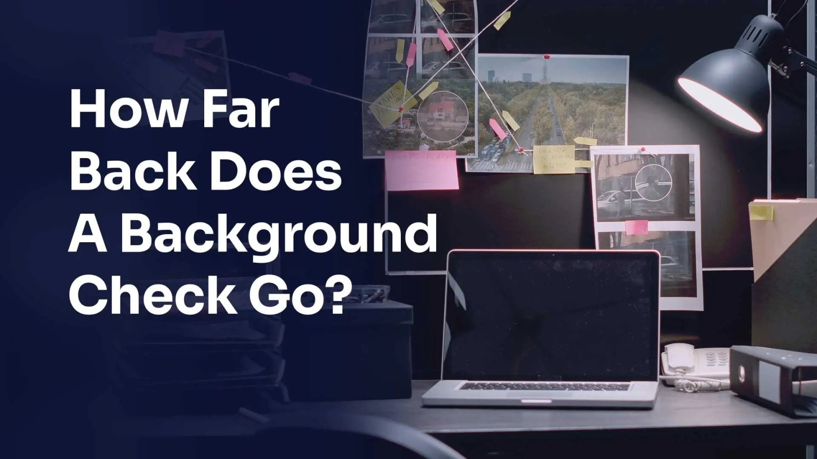 how far back does a background check go title in front of laptop on desktop with photos