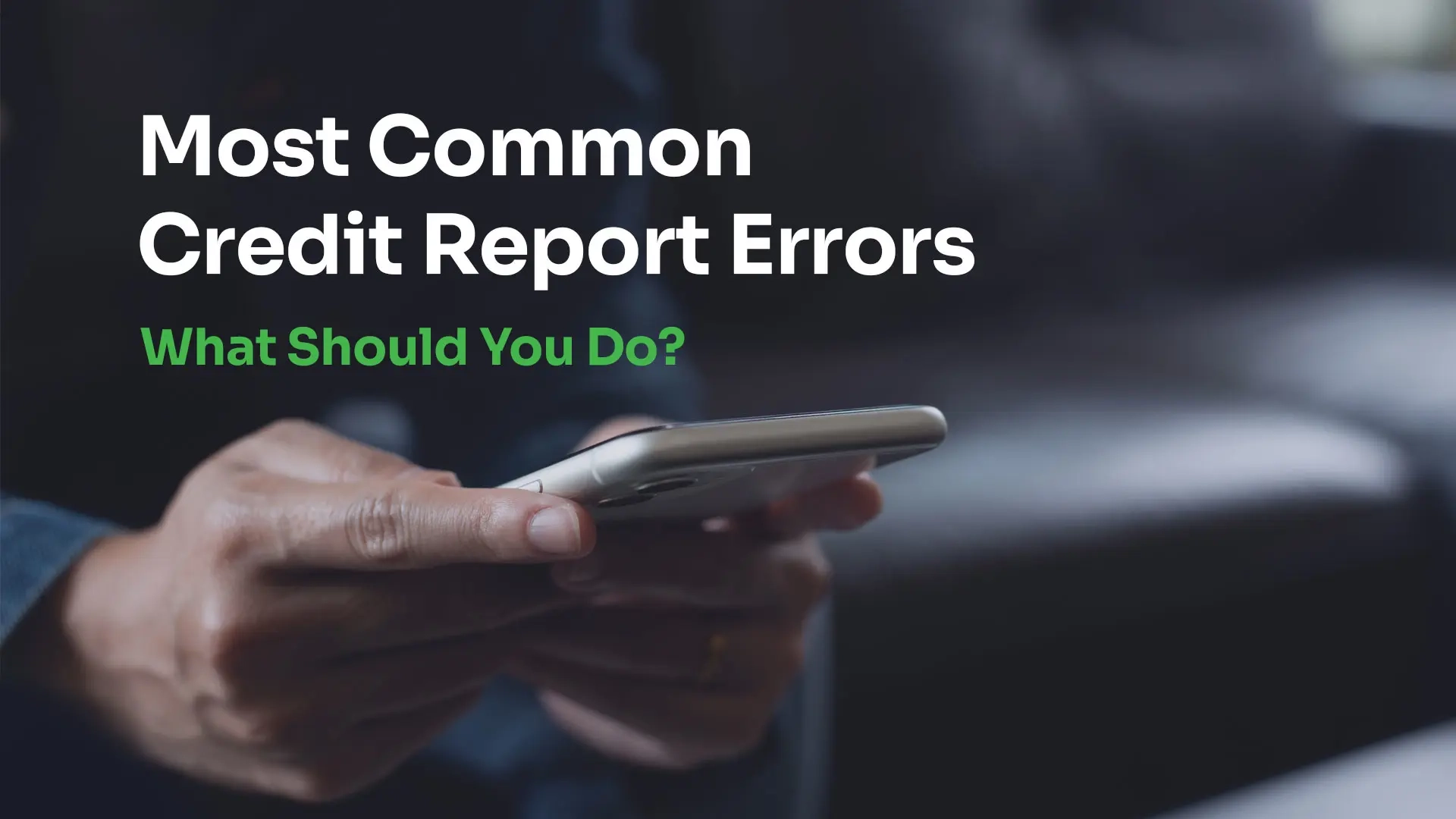 man holding a phone looking at his credit report