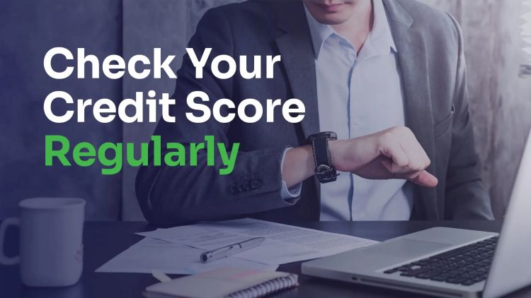 how often should you check your credit report a man sits at the table and looks at the watch