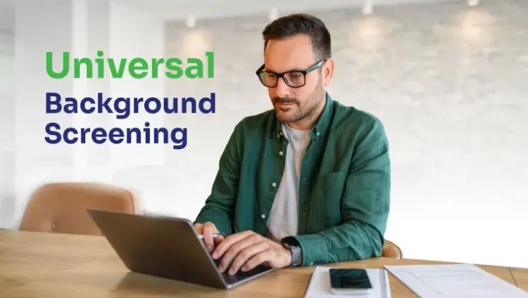 Universal Background Screening Man in glasses working behind the laptop