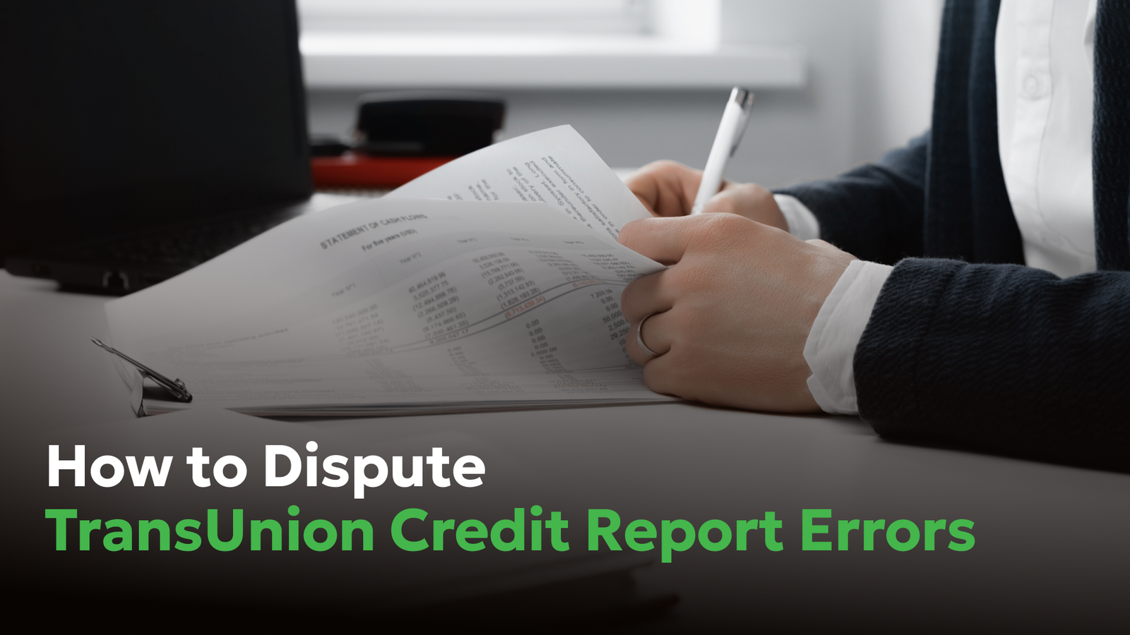 Person reviewing financial documents while learning how to dispute TransUnion credit report errors.
