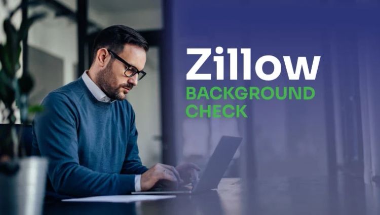 man in the office sitting in the laptop and checking his zillow background check
