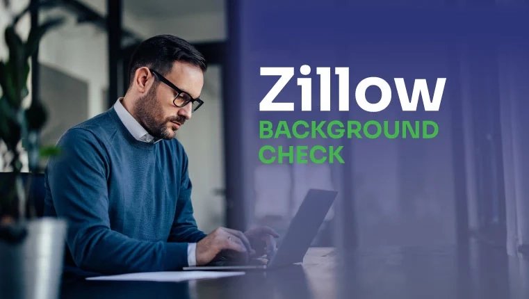man in the office sitting in the laptop and checking his zillow background check